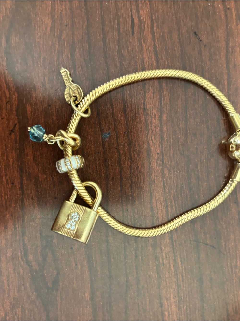 Pandora Gold-Tone Padlock Charm Bracelet with Blue Crystal and White Enamel